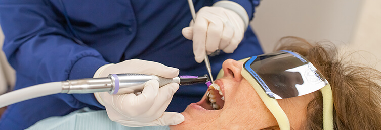 staff member working on a patient's smile